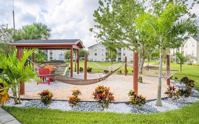 Hammocks under pavilion with outdoor seating playing area at Pointe at Central in Orlando Student Accommodation