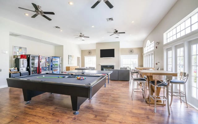 Pool table vending machines lounge area living room at Pointe at Central in Orlando Student Accommodation