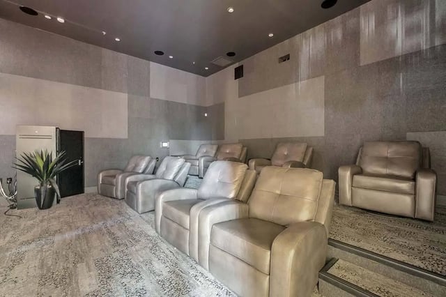 Recliner chairs in a tiered room cinema at West 10 in Tallahassee Student Accommodation