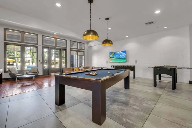 Pool table foosball tables television living room at West 10 in Tallahassee Student Accommodation