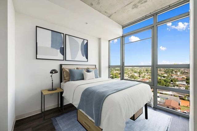 Bed side table with lamp and artwork bedroom at Terrazul in Miami Student Accommodation