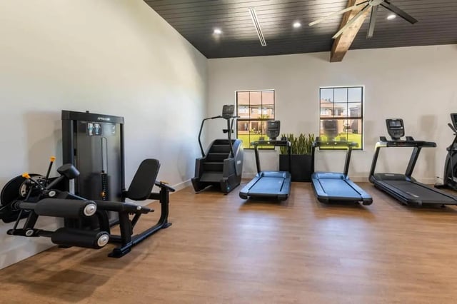 Weight machine treadmills stair climber gym at The Annex at Campus West in Tallahassee Student Accommodation