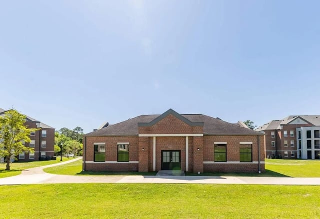 Brick building with double doors and windows exterior at The Annex at Campus West in Tallahassee Student Accommodation