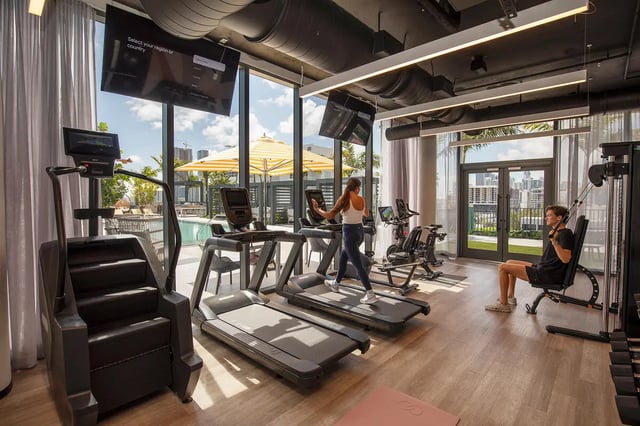 Treadmills stair climber and weight machine gym room at I5 WYNWOOD in Miami Student Accommodation