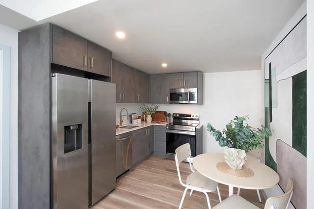 Stainless steel refrigerator oven cabinets sink dining table kitchen at I5 WYNWOOD in Miami Student Accommodation