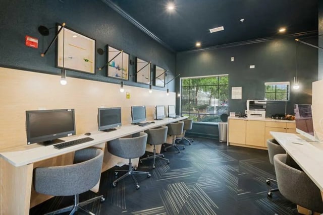 Computers printers and chairs study area at The Verge Orlando in Orlando Student Accommodation