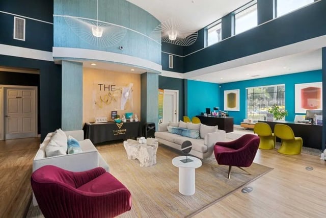 Sofa tables chairs reception desk living room at The Verge Orlando in Orlando Student Accommodation