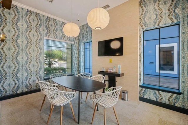 Dining table chairs and television common area at The Verge Orlando in Orlando Student Accommodation