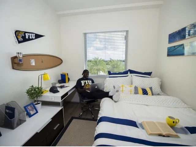 Student in room with desk and bed bedroom at Bayview Miami in Miami Student Accommodation