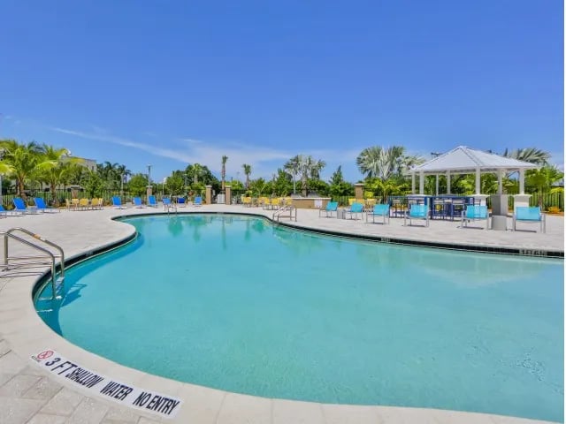 Outdoor swimming pool with lounge chairs and gazebo at Bayview Miami in Miami Student Accommodation