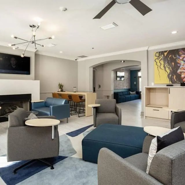 Modern lounge with seating and bar area. at Windsor Hall in Gainesville Student Accommodation