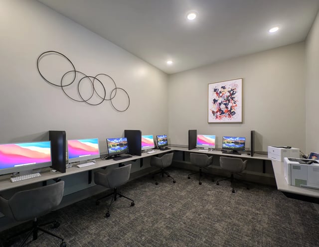 Computers printers and chairs study area at The Metropolitan Tallahassee in Tallahassee Student Accommodation