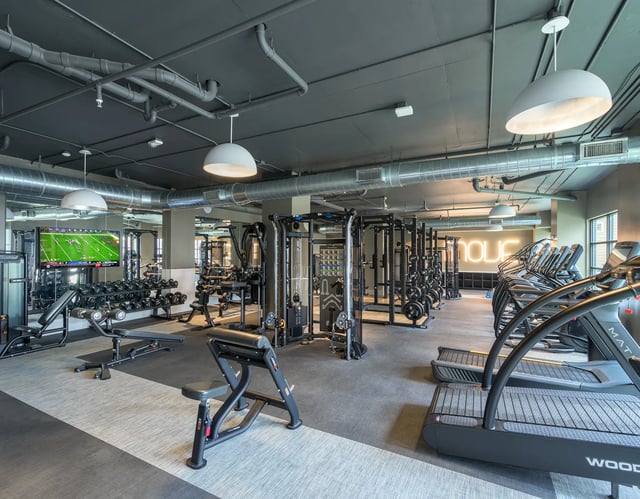 Dumbbells treadmills and weight machines gym at The Metropolitan Tallahassee in Tallahassee Student Accommodation