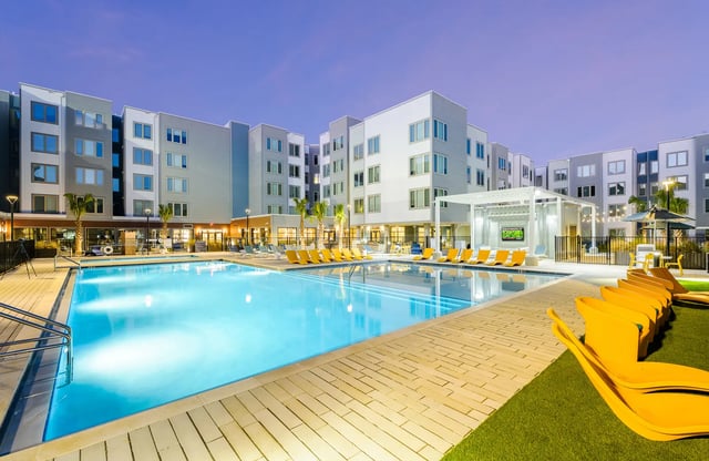 Pool with lounge chairs exterior at The Metropolitan Tallahassee in Tallahassee Student Accommodation