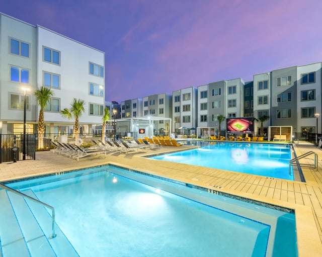 Pool with loungers and outdoor screen exterior at The Metropolitan Tallahassee in Tallahassee Student Accommodation