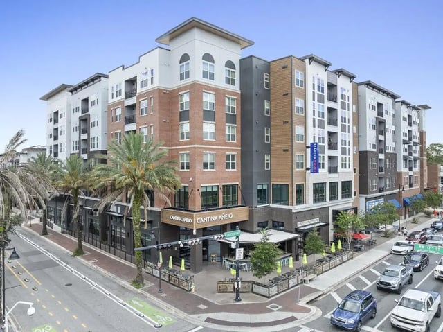 Modern apartment building with street level shops exterior at Stadium House Gainesville in Gainesville Student Accommodation