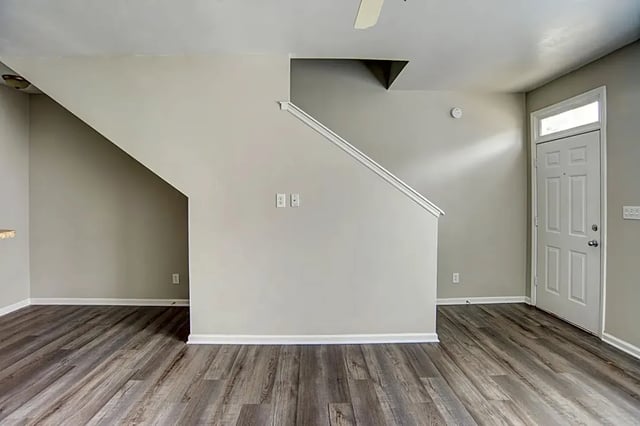 Staircase leading to upper floor and front door living room at The Premier Townhomes at 1694 in Tallahassee Student Accommodation