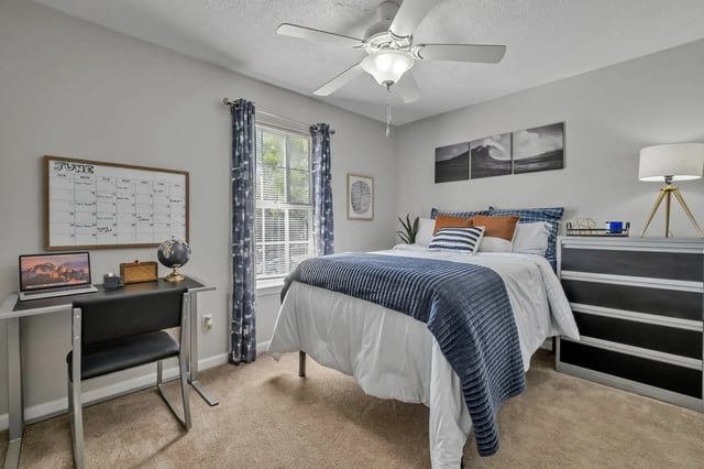 Bed desk dresser calendar artwork window bedroom at Polo Club Tallahassee in Tallahassee Student Accommodation