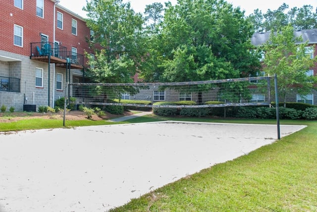 Volleyball court with sand and net Exterior at Polo Club Tallahassee in Tallahassee Student Accommodation