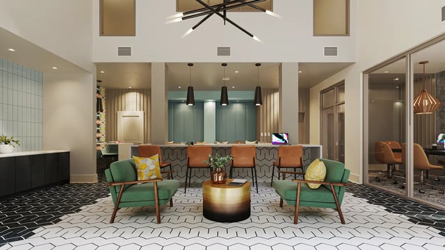 Green armchairs gold table patterned floor lounge at The Mark Tallahassee in Tallahassee Student Accommodation