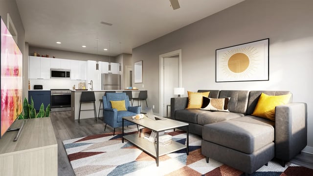 Modern living room kitchen with gray sectional sofa at The Mark Tallahassee in Tallahassee Student Accommodation