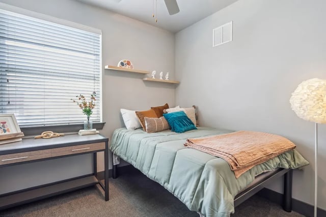 Bed desk and lamp bedroom at Oktiv in Tallahassee Student Accommodation