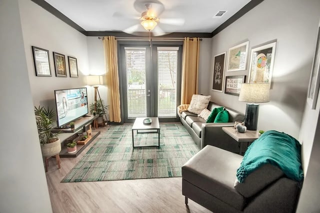 Sofa television coffee table rug living room at Oktiv in Tallahassee Student Accommodation