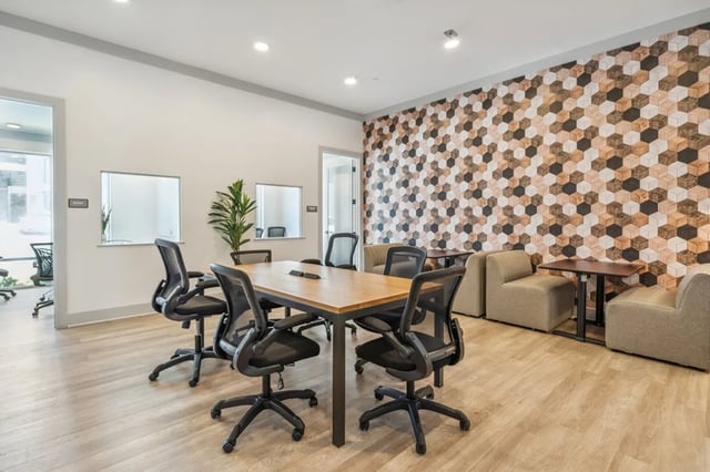 Wooden table with chairs and sofas Study area at Oktiv in Tallahassee Student Accommodation