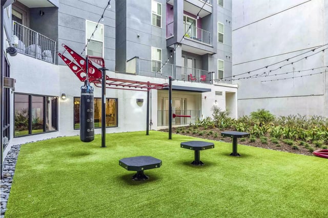 Punching bag monkey bars tables playing area exterior at Statehouse Tallahassee in Tallahassee Student Accommodation