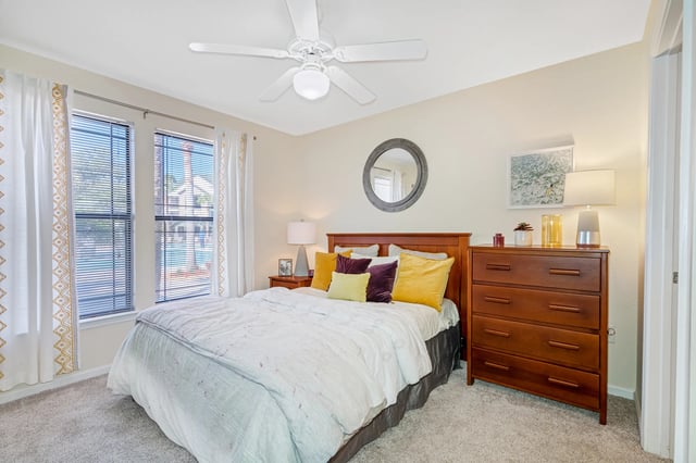 Bed dresser mirror curtains ceiling fan bedroom at Forest Lake in Lutz Student Accommodation
