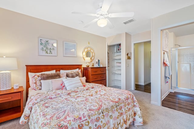 Bed with pillows dresser closet and shower bedroom at Forest Lake in Lutz Student Accommodation
