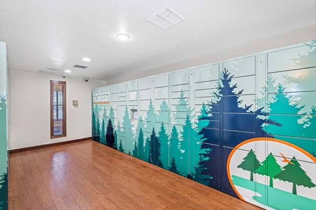 Locker bank with forest mural wooden floor entry area at Forest Lake in Lutz Student Accommodation
