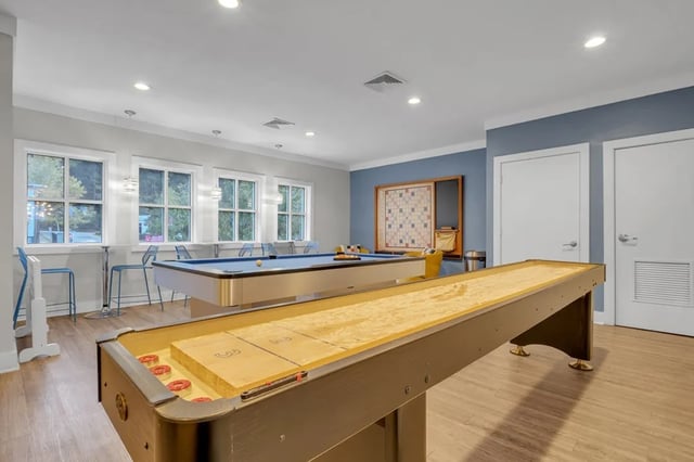 Shuffleboard table pool table game room at The Preserve at San Luis in Tallahassee Student Accommodation