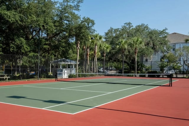 Tennis court net green court red court gazebo Exterior at Gainesville Place in Gainesville Student Accommodation