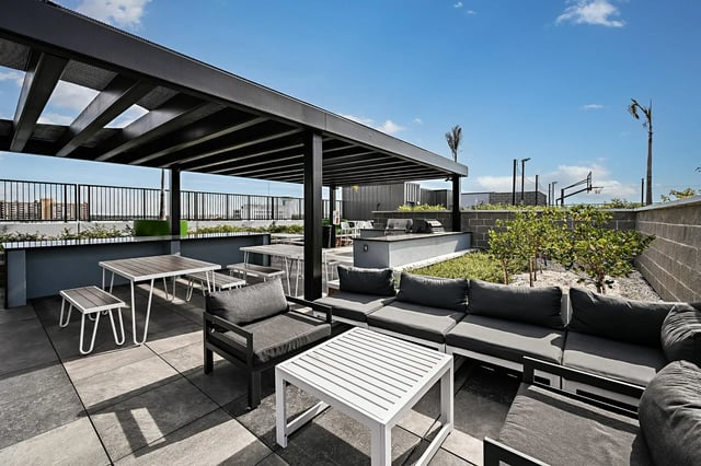 Outdoor lounge seating and dining tables playing area at Park Place Tampa in Tampa Student Accommodation
