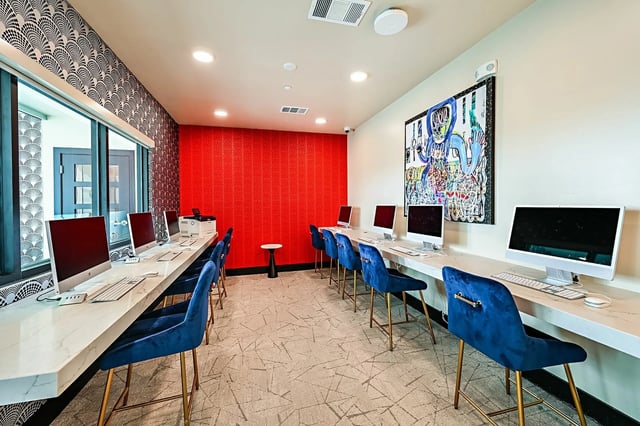 Computers and blue chairs study area at Park Place Tampa in Tampa Student Accommodation