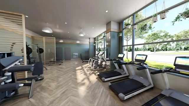 Treadmills weight machines gym equipment workout area fitness room at Nine31 in Gainesville Student Accommodation