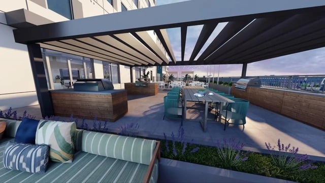 Outdoor seating area with grills and tables exterior at Nine31 in Gainesville Student Accommodation