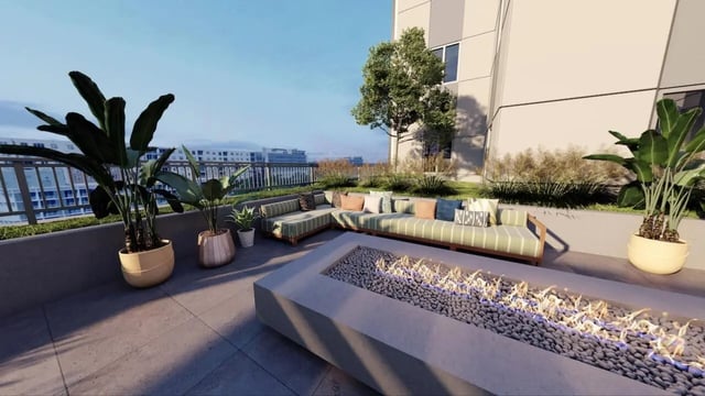 Sofa fire pit plants outdoor lounge area at Nine31 in Gainesville Student Accommodation