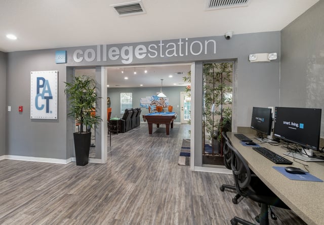 Computers with chairs and pool table common area at College Station Orlando in Orlando Student Accommodation