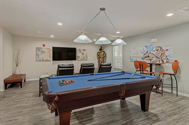 Pool table chairs and TV communal room Image at College Station Orlando in Orlando Student Accommodation