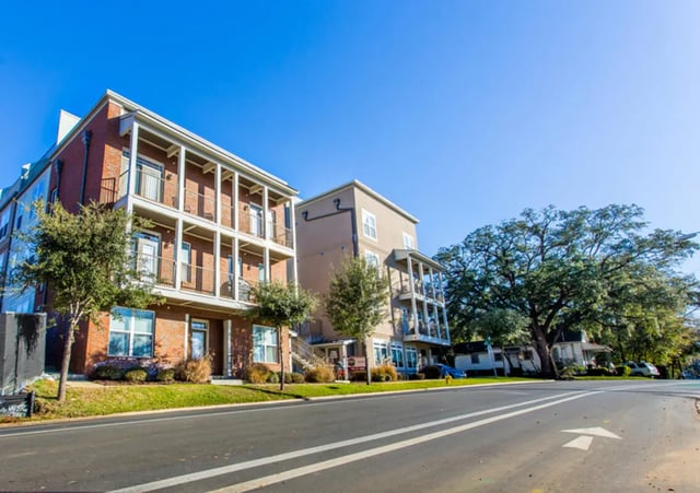 Brick apartment buildings with balconies and trees exterior at CollegePlace - Paces in Tallahassee Student Accommodation