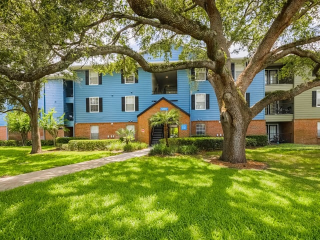 Blue apartment building with windows and balconies exterior at Reflections in Tampa Student Accommodation