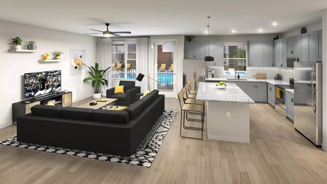 Living room with sofa kitchen island and pool view at The 9 UCF in Orlando Student Accommodation