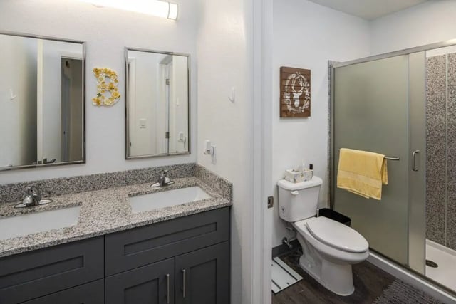Double vanity toilet shower enclosure bathroom at 220 Madison in Tampa Student Accommodation