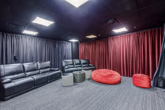 Black leather sofas round table beanbags living room at 220 Madison in Tampa Student Accommodation