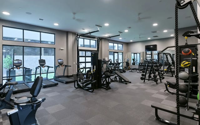 Treadmills weight machines benches exercise room at The Nine at Tallahassee in Tallahassee Student Accommodation