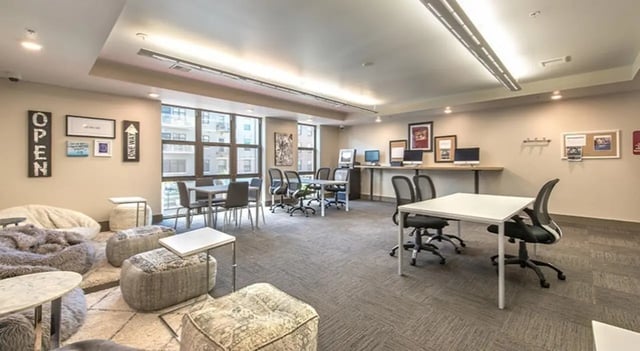 Beanbags tables computers chairs and windows common area at FSU Collegetown in Tallahassee Student Accommodation