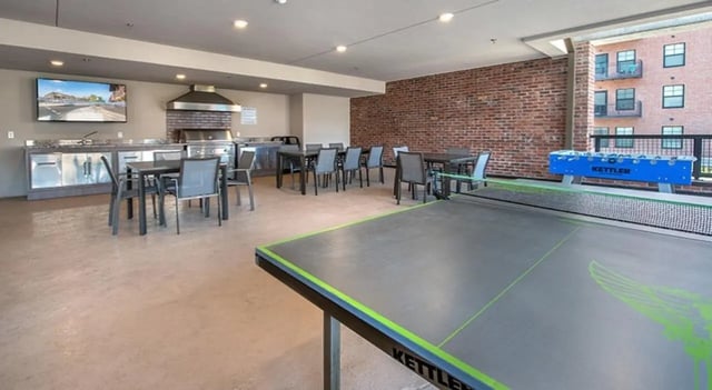 Ping pong table foosball table kitchen area recreation room at FSU Collegetown in Tallahassee Student Accommodation