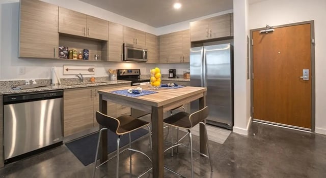 Modern kitchen with island and bar stools kitchen at FSU Collegetown in Tallahassee Student Accommodation